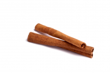 Two cinnamon sticks isolated on white © Aliaksei Smalenski
